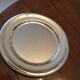 Round plate in silver metal