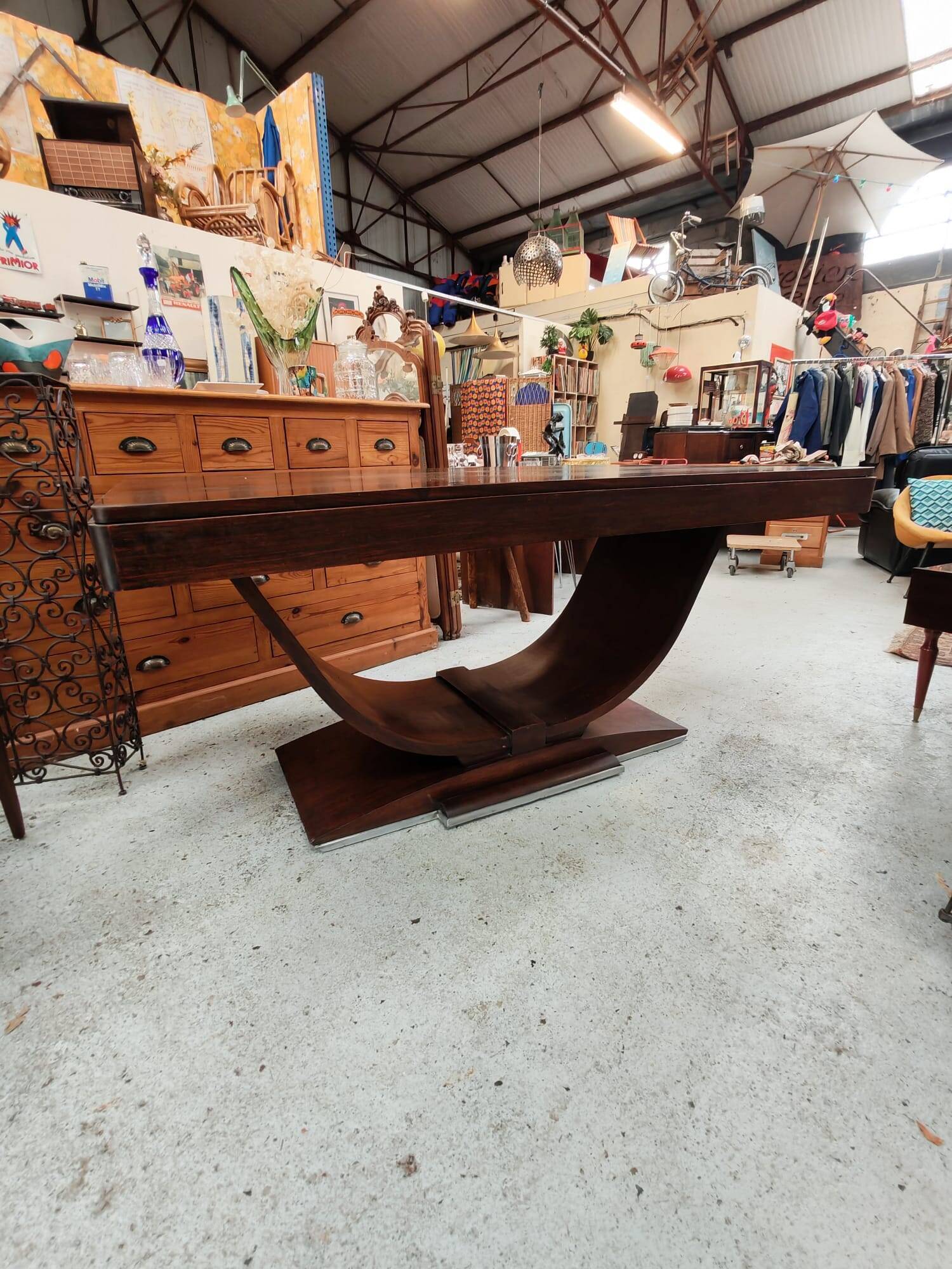 Art Deco dining table with a central cradle base from the 1930s.