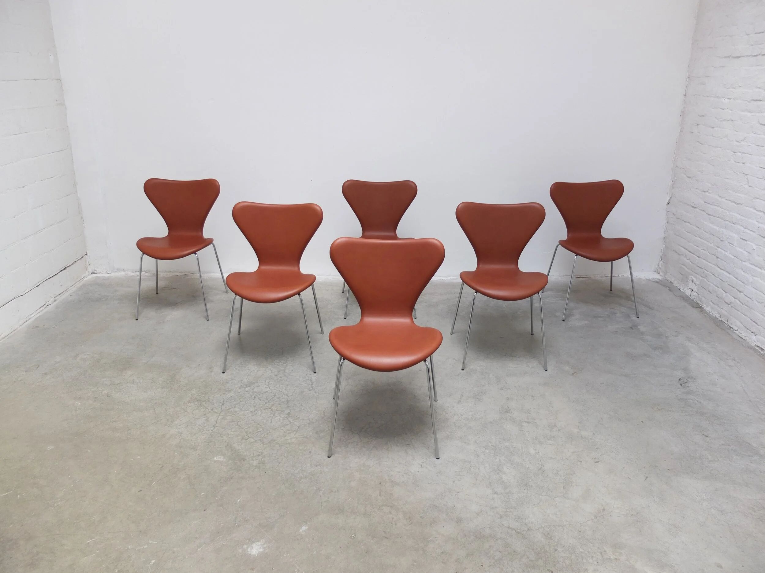 'Series 7' chairs in cognac leather by Arne Jacobsen for Fritz Hansen, 1955