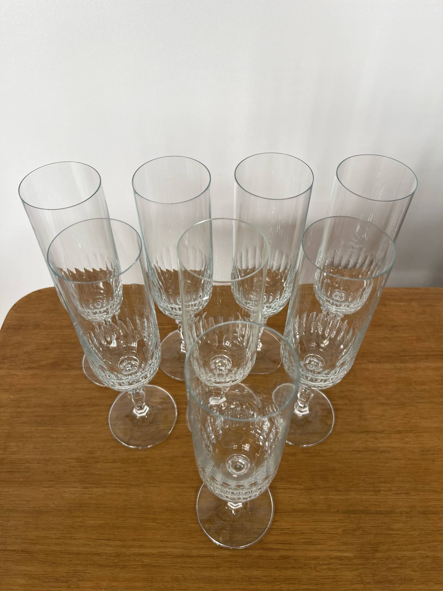 Set of 8 crystal champagne flutes in classic design.