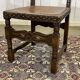 High-backed chair from the early 20th century in oak and leather