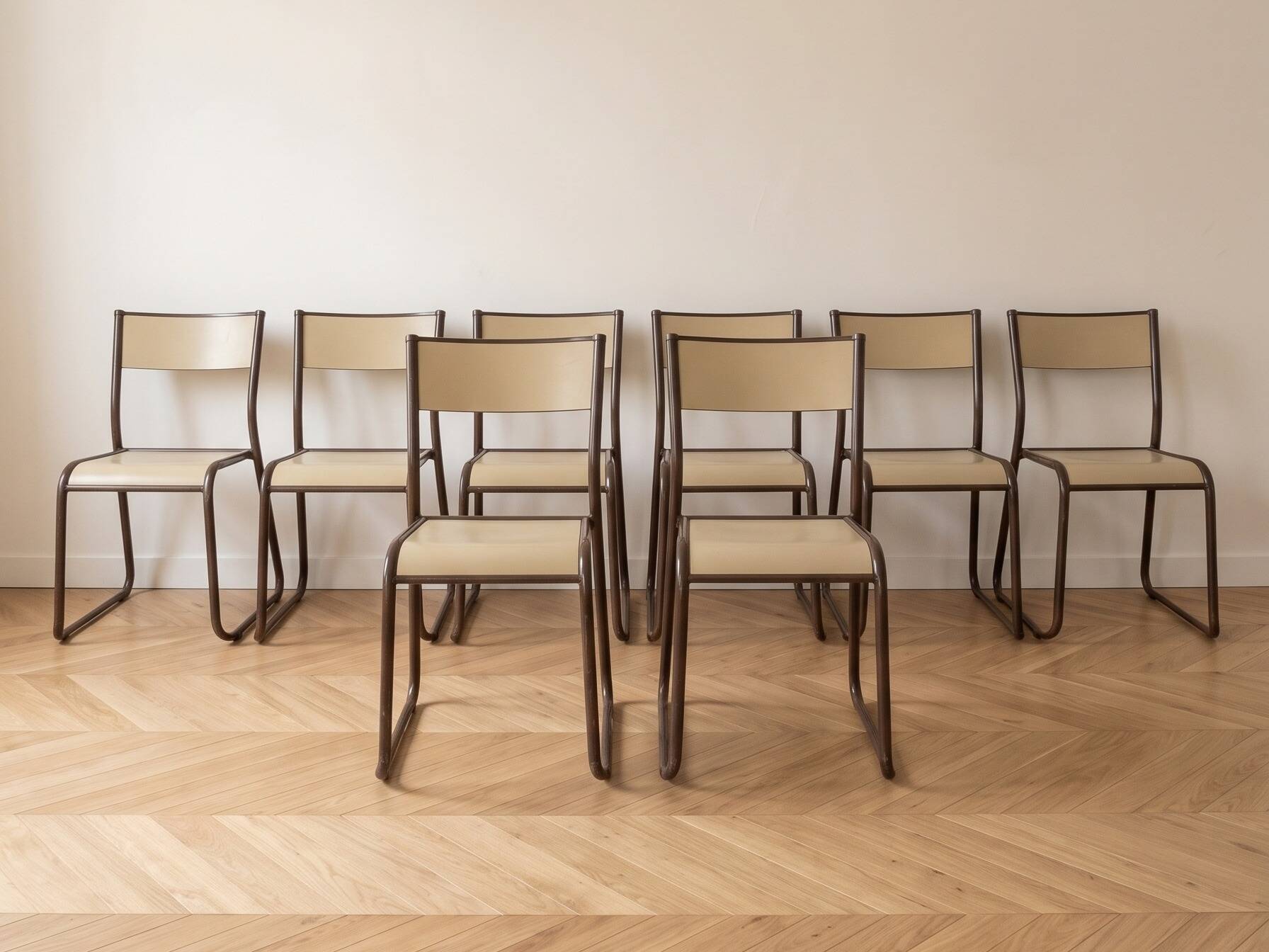 Set of 8 vintage industrial style chairs in metal and wood.