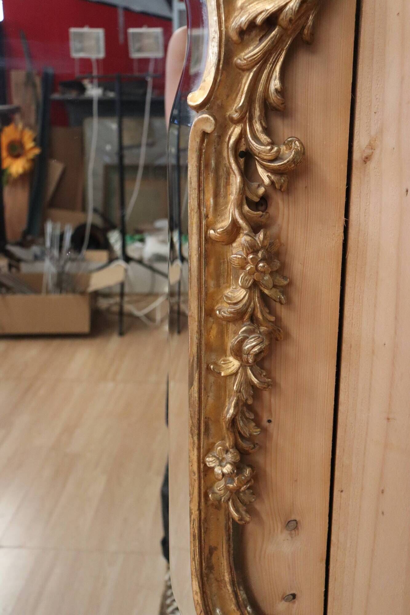 Golden wooden mirror in Louis XV style