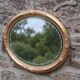 Miroir ovale vintage doré à décor floral et verre biseauté – 58 × 48 cm
