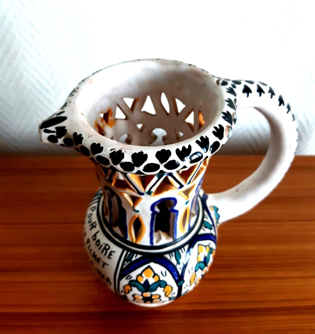 Deceptive pitcher in glazed earthenware