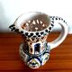 Deceptive pitcher in glazed earthenware
