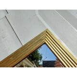 Wooden mirror and gold trim