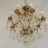 French Louis XV chandelier with 8 lights in gilded bronze, glass and crystal.