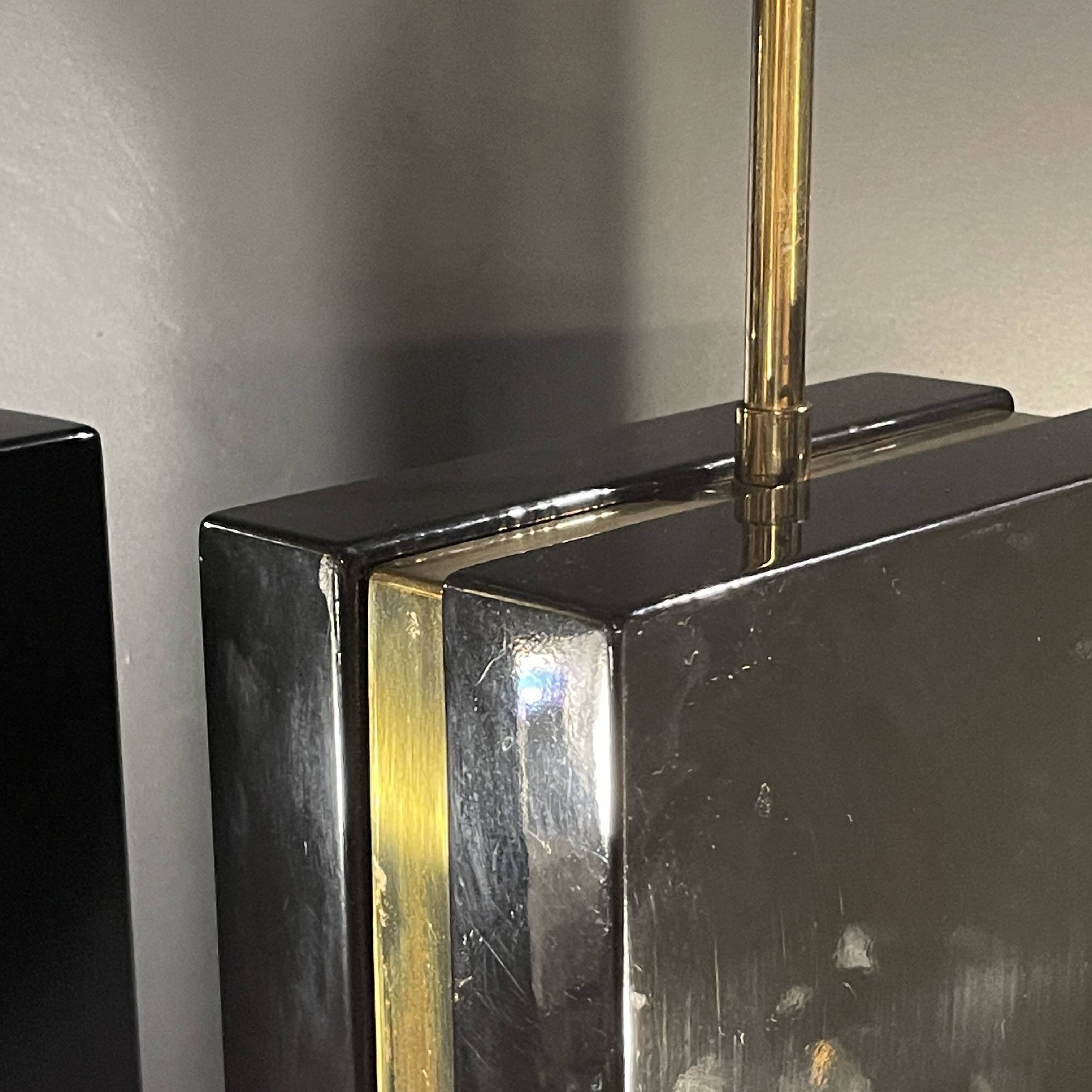 Pair of black lacquered and brass table lamps, circa 1970