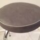 Table in white Formica, 3 chairs and 1 stool in gray leatherette