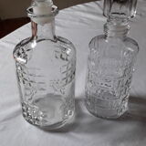Set of 2 chiseled glass liquor decanters