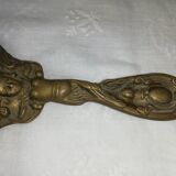 Old hand-facing mirror in gilded bronze