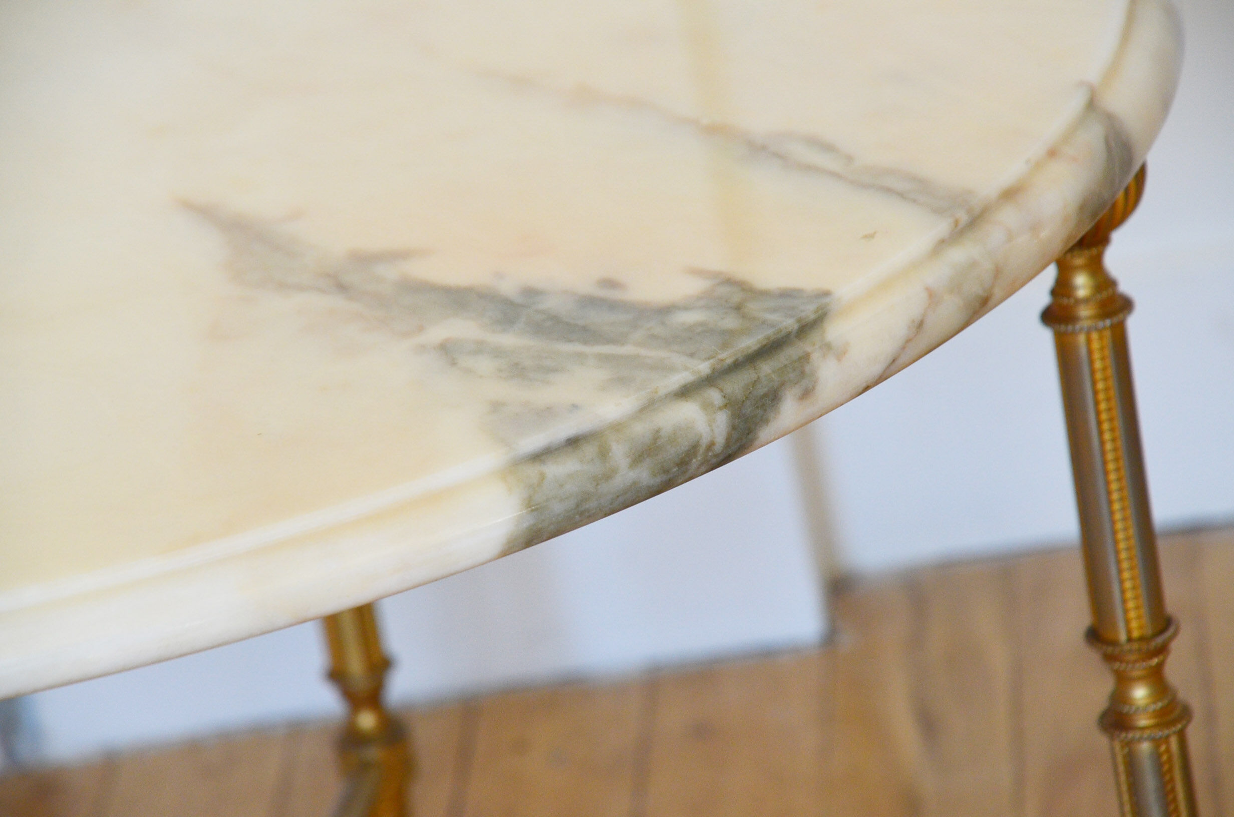 Round coffee table in 1960s neoclassical marble style
