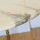 Round coffee table in 1960s neoclassical marble style
