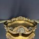 Art Nouveau jardinière in gilded bronze with holly decoration, signed E. Gros.