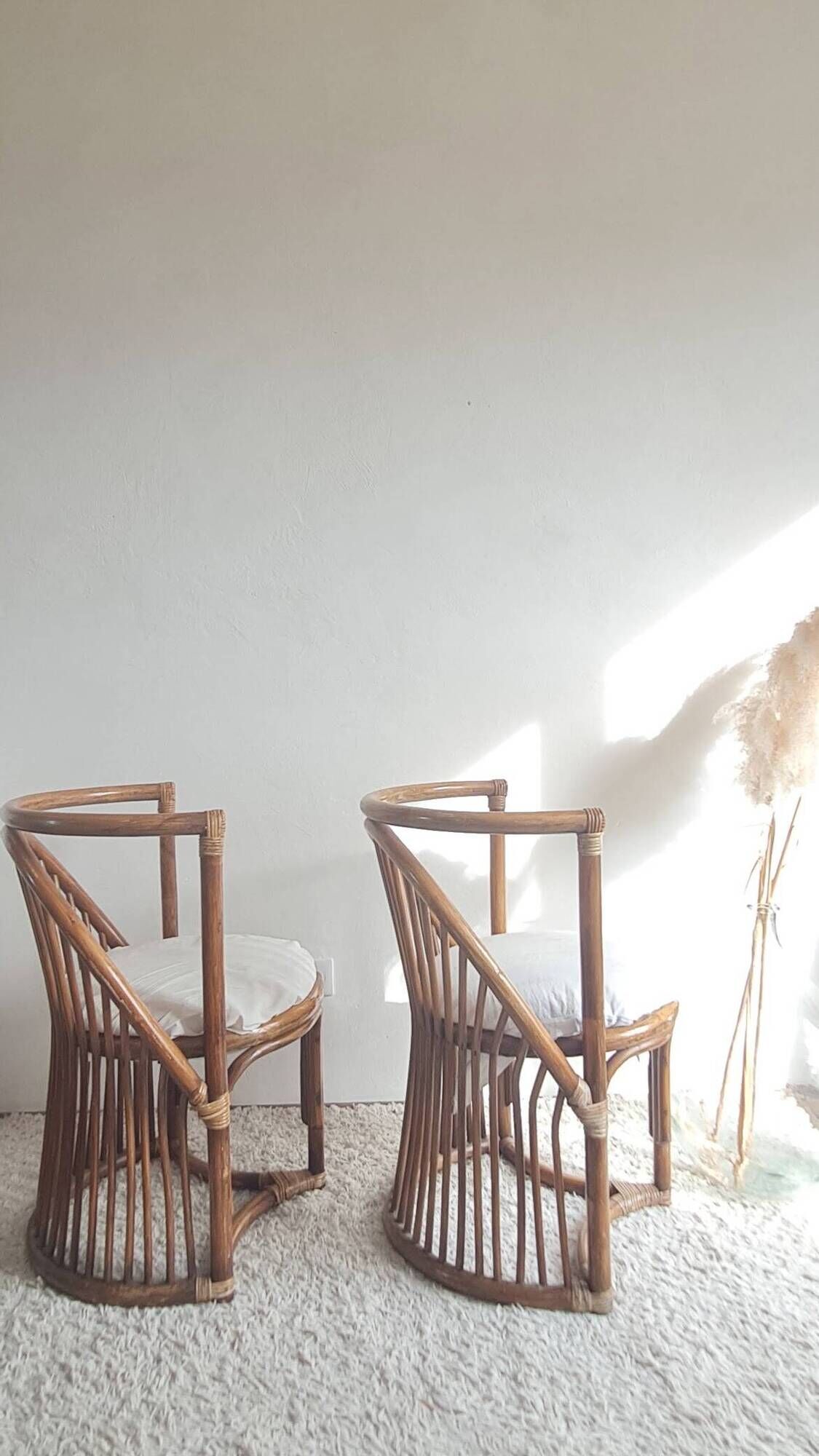 Pair of vintage rattan armchairs circa the 1960s.