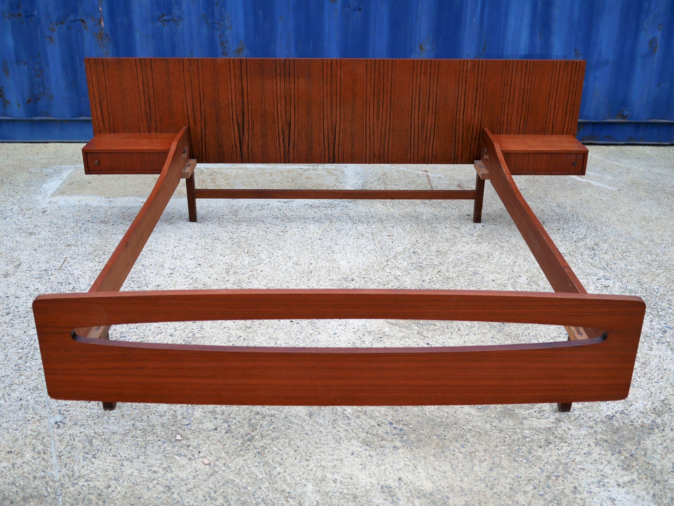 Teak bed with hanging bedside tables from the 60s