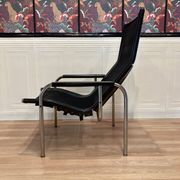PAIR OF BLACK LEATHER AND CHROME ARMCHAIRS BY HANS EICHENBERGER 1960.