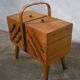 Worker sewing box feet compass