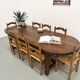 Set of 8 chairs in solid elm with straw seats.
