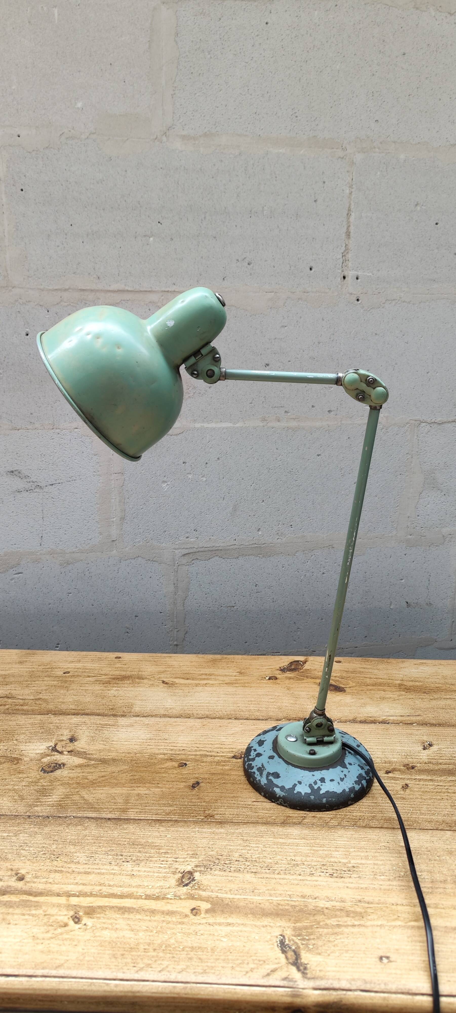 Old green industrial desk lamp