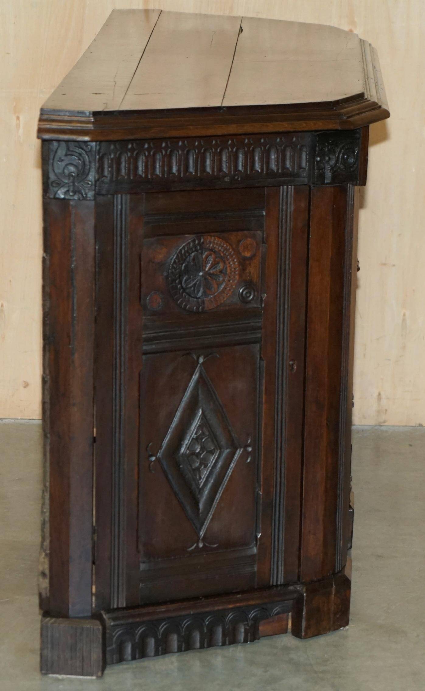 Hand-carved commode from 1685 with sideboards and side cupboards.