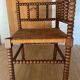 Corner chair made of wood and straw