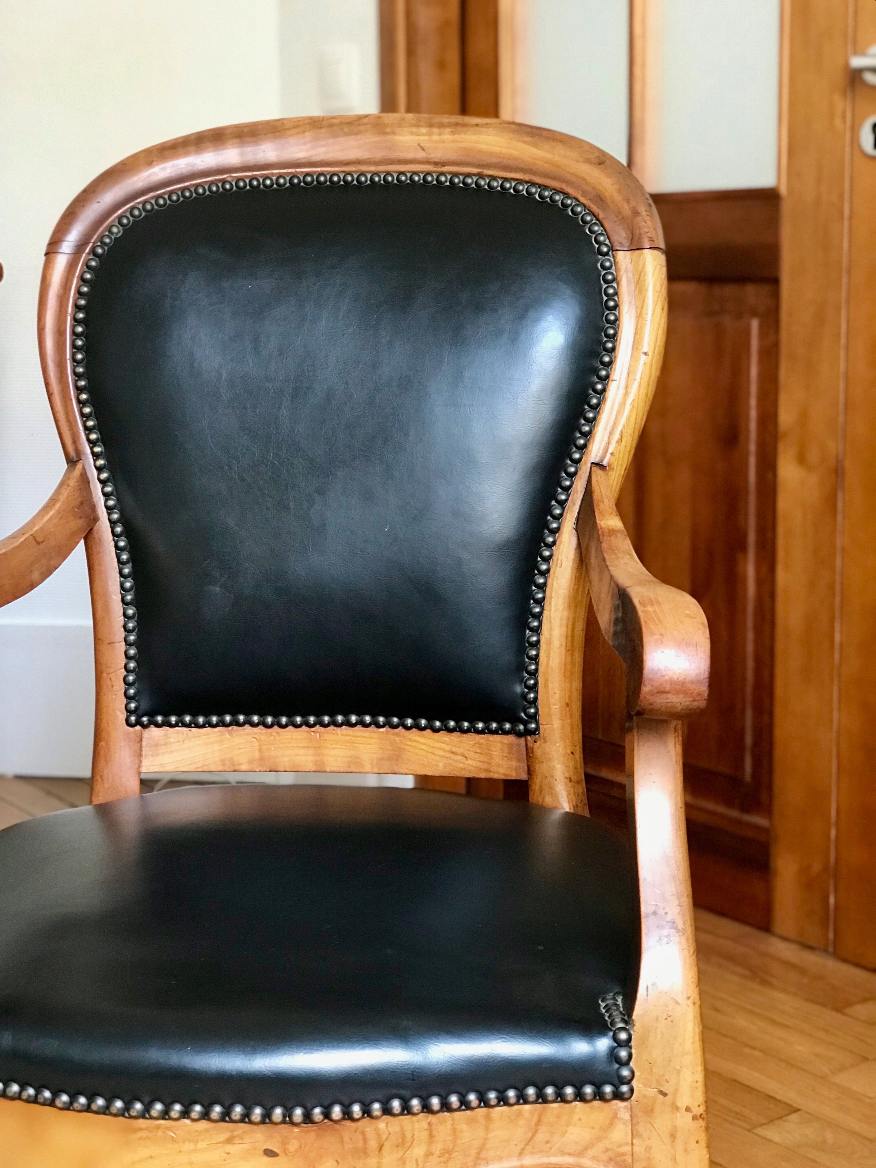 Wood and leather armchair