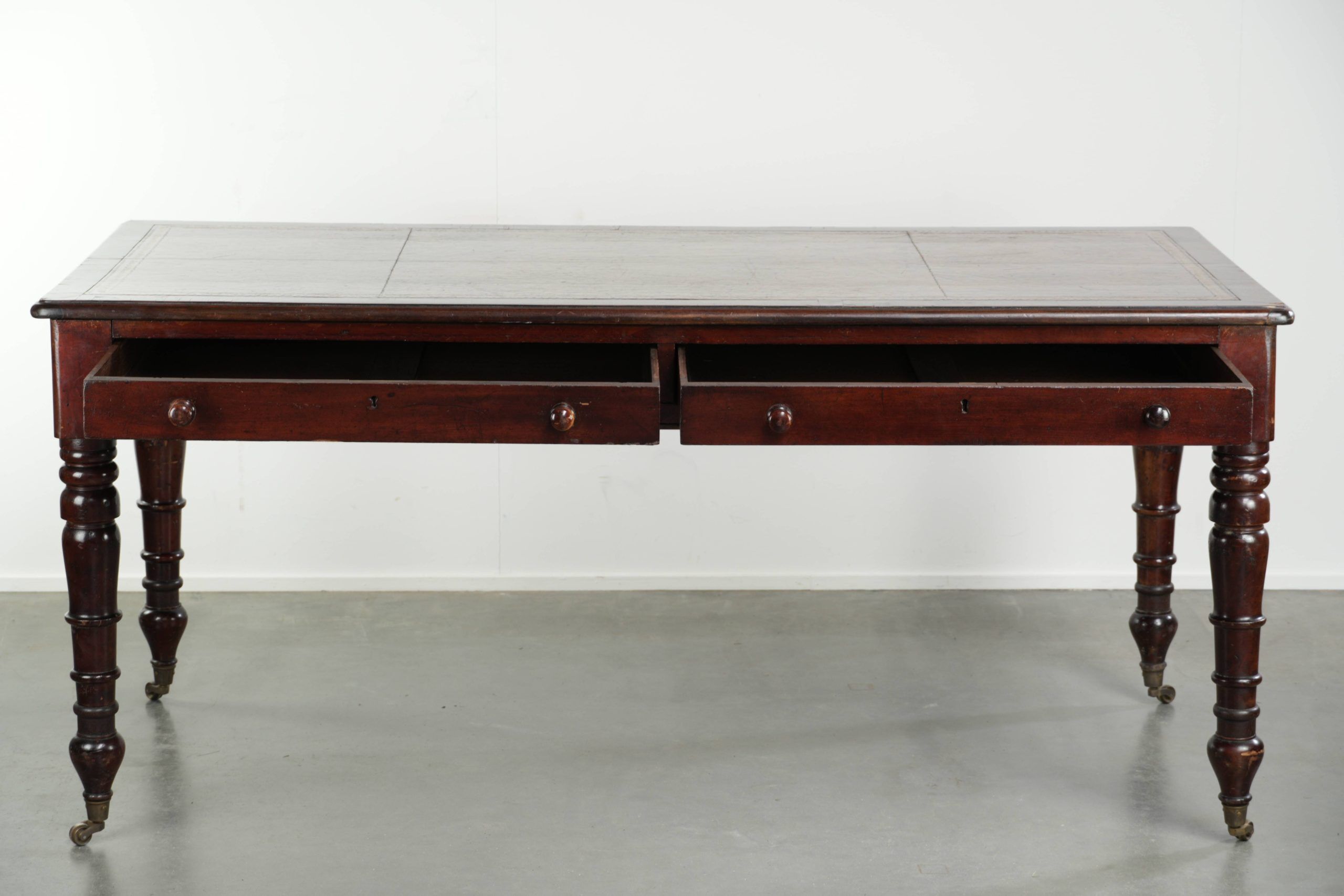 Antique English writing desk from the late 19th century with a warm colour