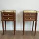 Pair of mahogany and brass side tables or bedside tables with Carrara marble tops.