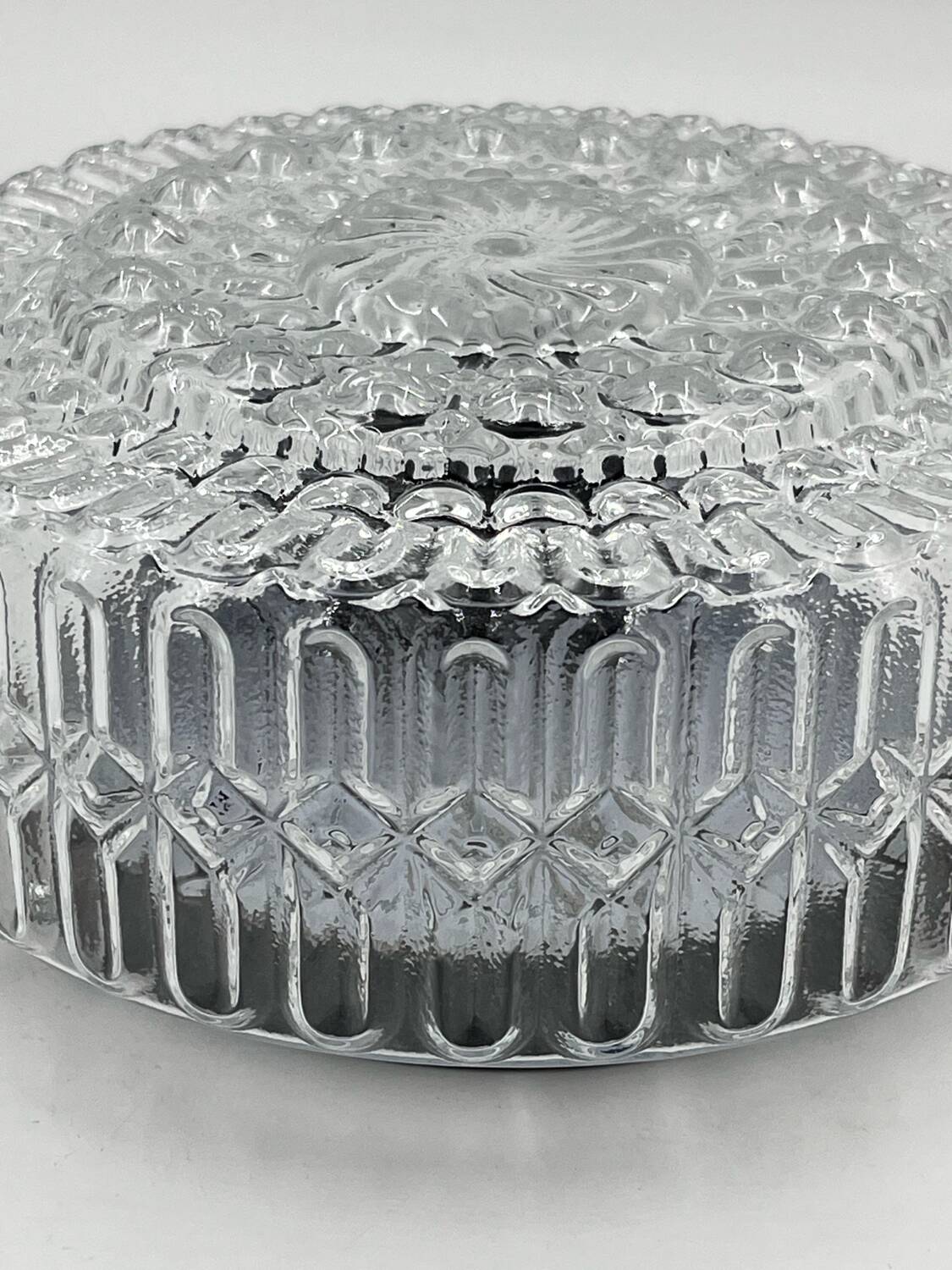 Molded glass ceiling light with relief