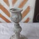 Candlestick holder patinated white gray