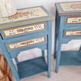 Blue wooden bedside tables with floral patterns