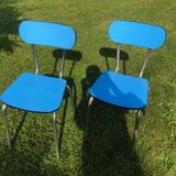 Two blue chairs in formica