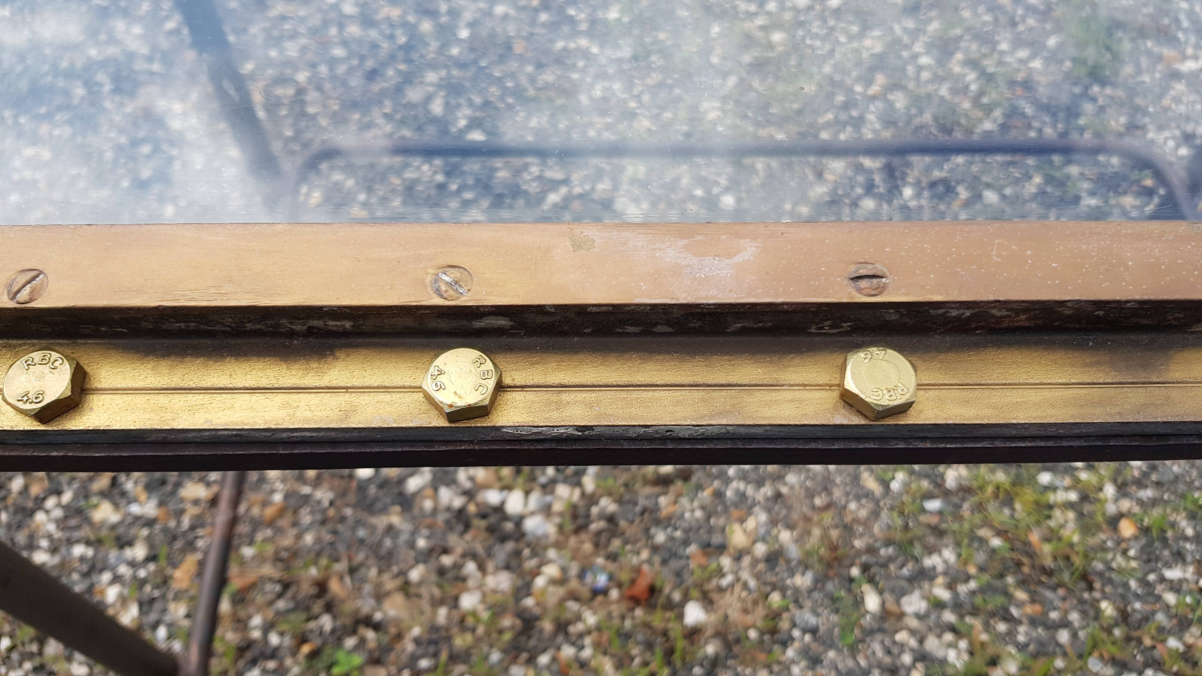 Table with an old ship porthole in brass and a metal base / 110 x 70 x 76 cm