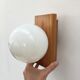 Modernist wall lamp in pine and opaline