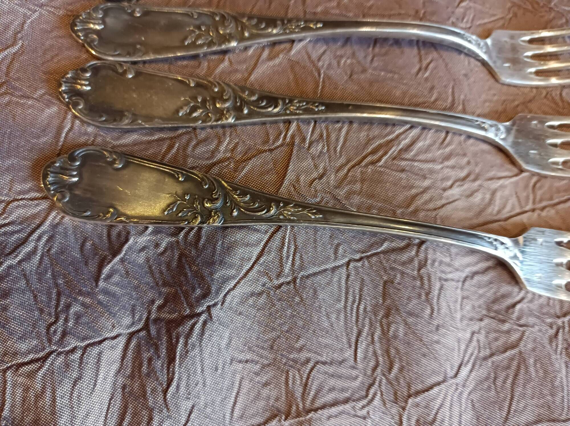 5 silver forks