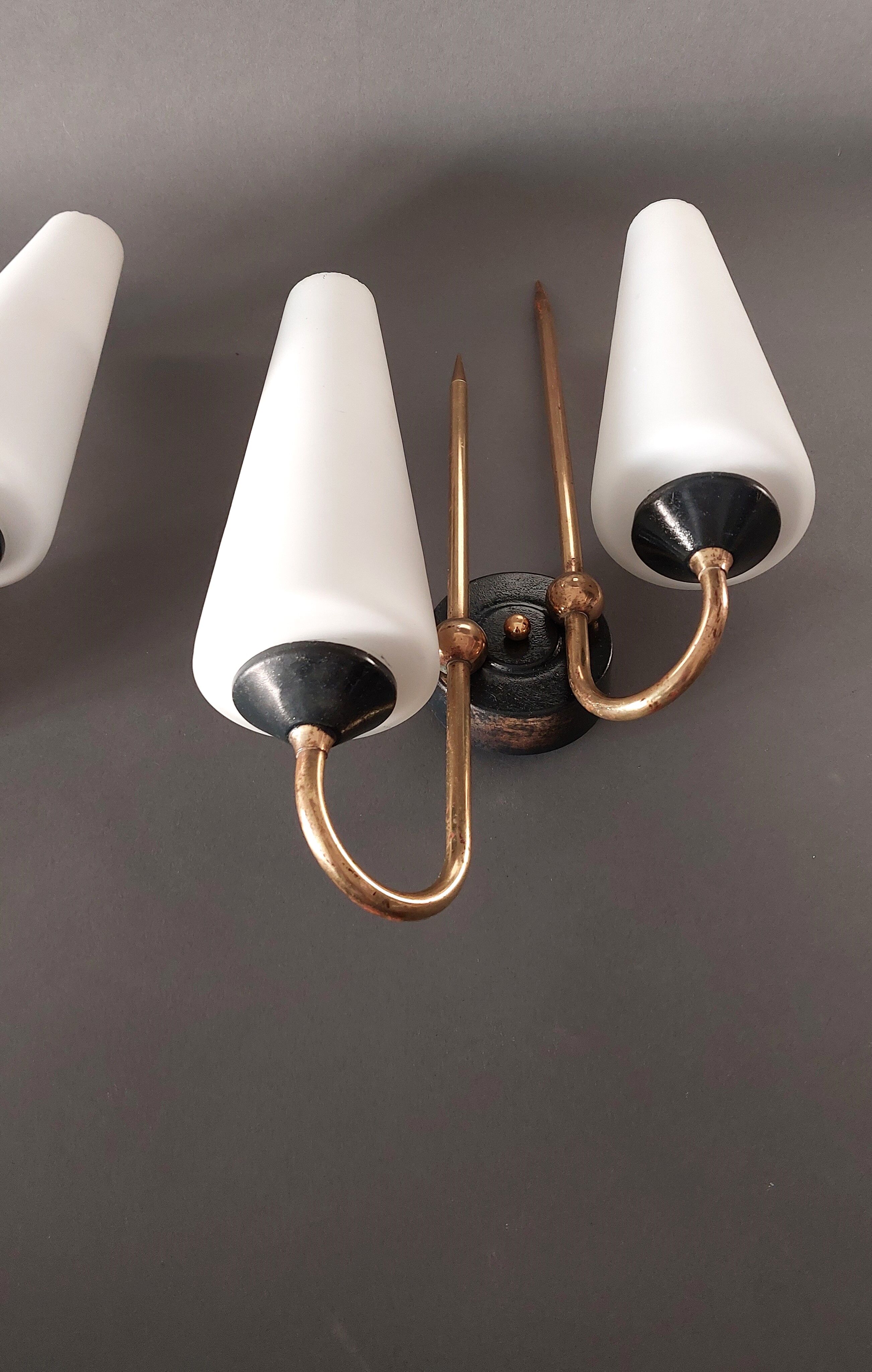 Pair of sconces in black metal and gilded brass 1960 Vintage.