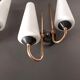 Pair of sconces in black metal and gilded brass 1960 Vintage.