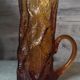 Pitcher and its glasses in amber glass