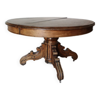 Old table with central leg, small casters, 2 extensions