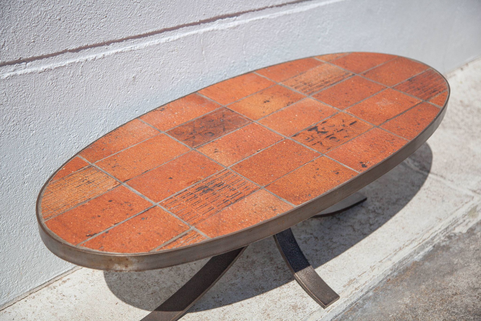 Table basse Jean Jaffeux, en pierre de lave émaillée avec structure en fer forgé, 60's