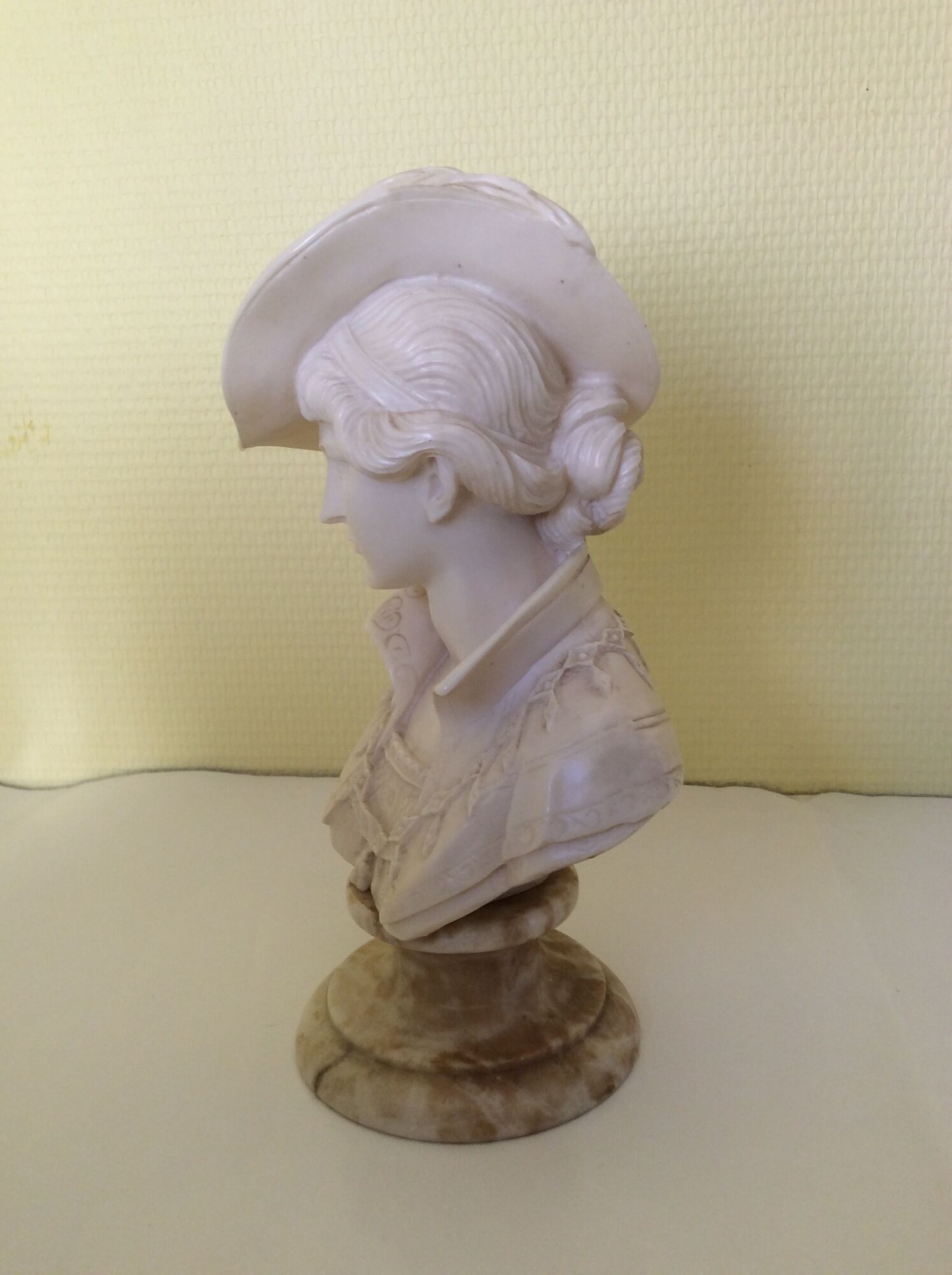 Bust of a young woman in the hat of A. Giannelli