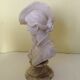 Bust of a young woman in the hat of A. Giannelli