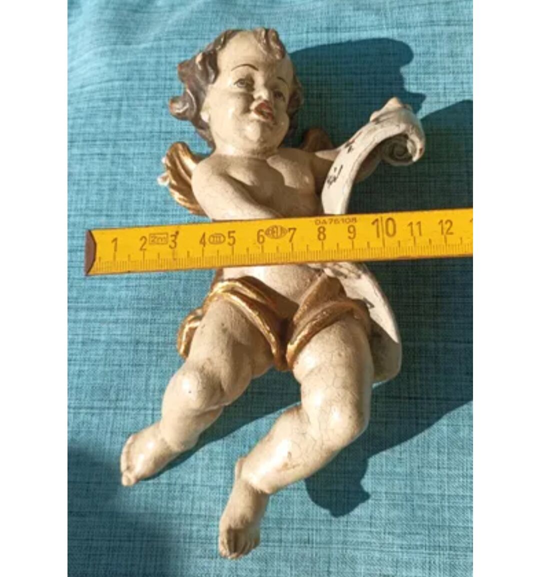 Golden white wooden cherub