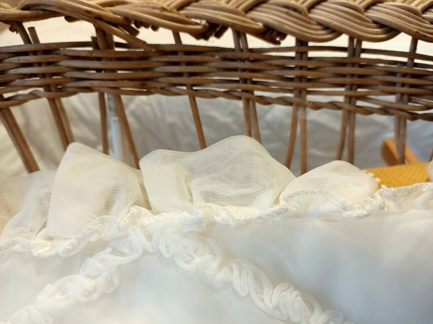 Rattan and wrought iron cradle