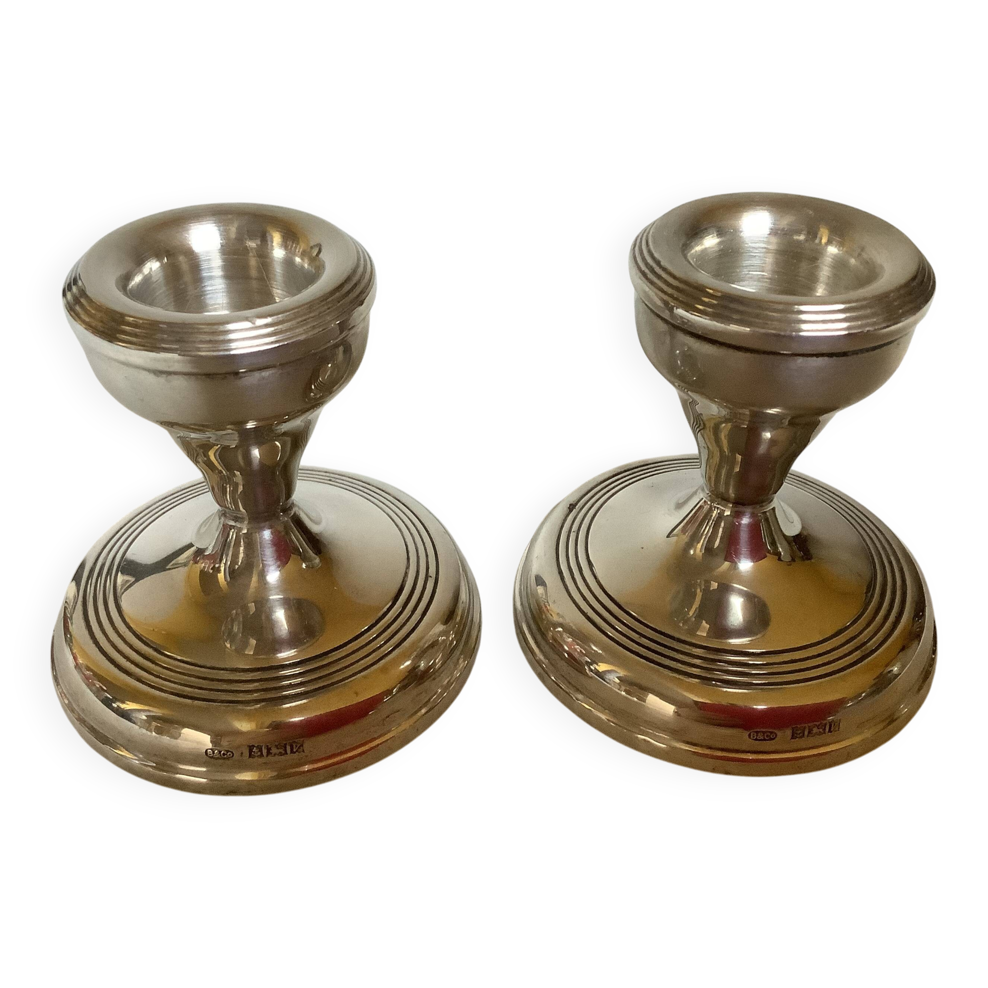 Pair of small silver candlesticks with hallmarks