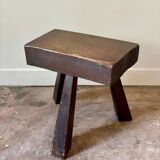 Brutalist tripod stool in dark wood