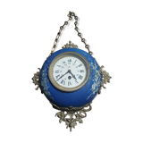 Wall clock in glazed earthenware decoration and brass chain empire style