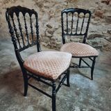 Pair of antique Napoleon III chairs in blackened wood and fabric